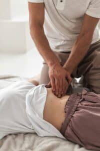 A person doing abdominal massage