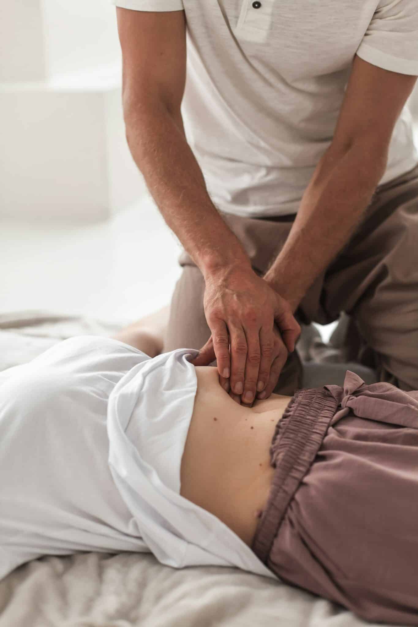 A person doing abdominal massage