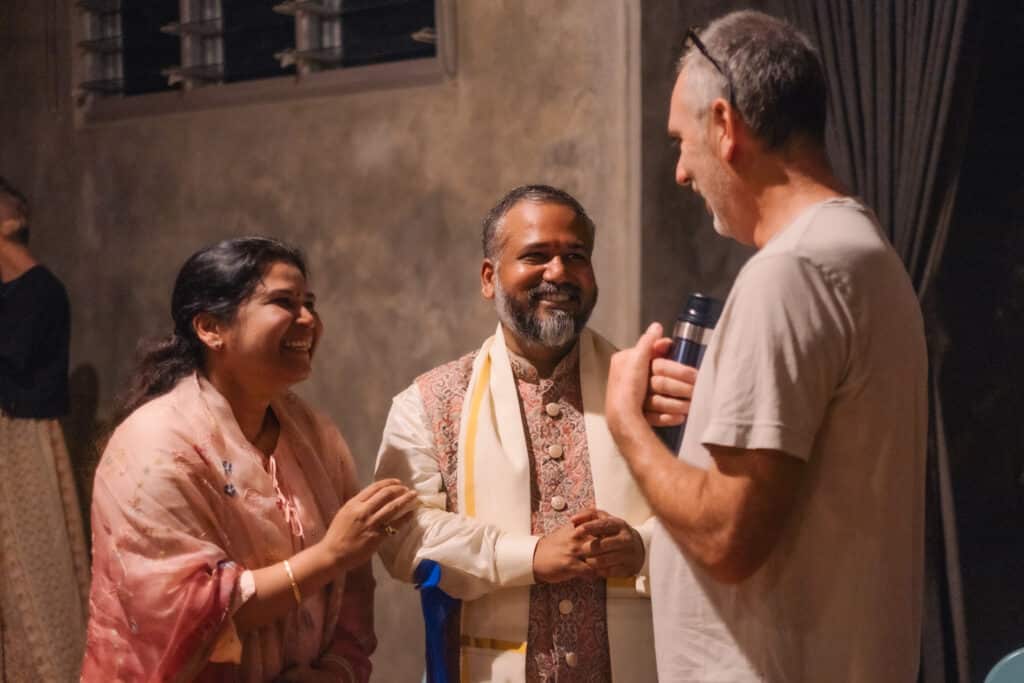 Pavani and Harsha Raju joyfully speaking to another person